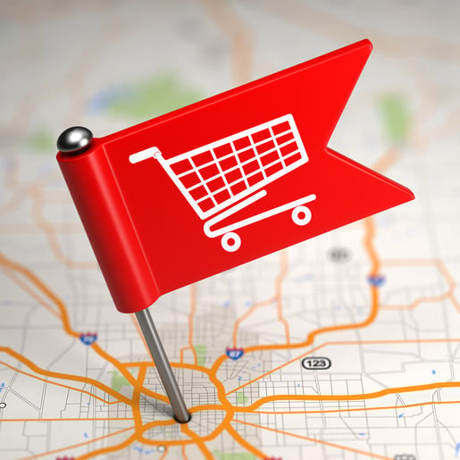 Shopping Concept - Small Flag on a Map Background with Selective Focus.